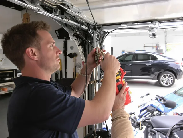 Dana Point Garage Door Repair safety certified technician performing cable replacement in Dana Point
